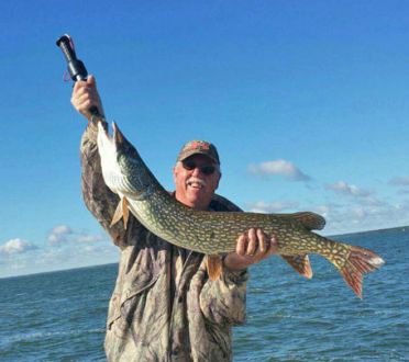 Retired Vice-President Gordon McCleary with a nice northern Pike in Saskatchewan Canada.